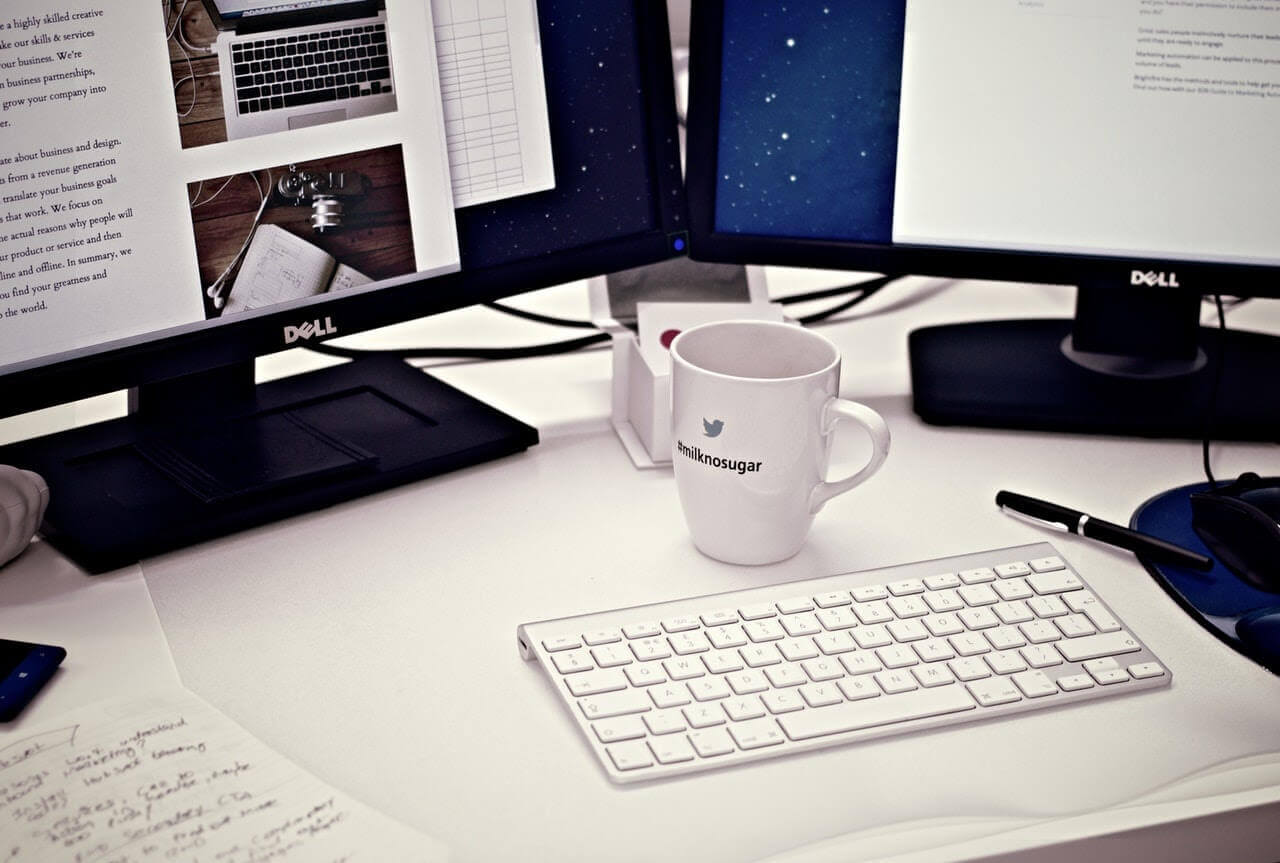 Computer and coffee on desk